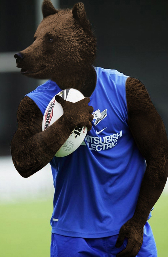 Un ours habillé en rugbyman et tenant un ballon de rugby